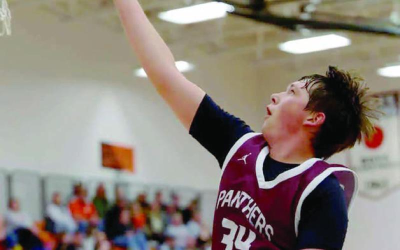 Timber Lake senior forward Rance Martin scored with a nifty finger- roll layup during recent boys basketball action against New Underwood. Photo by Marie DuPreez