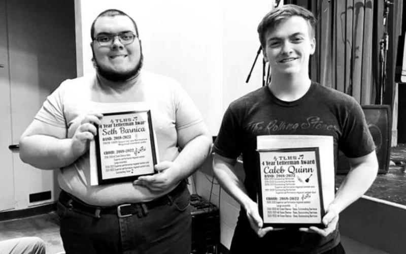 Two TLHS seniors, Seth Barnica (LEFT) and Caleb Quinn (RIGHT) were awarded plaques listing their many accomplishments in both band and choir over four years of high school.
