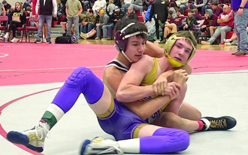 Timber Lake’s Sidney Morgan (left) works against Harding County’s Shay Smith in the 132-pound division of the Battler Wrestling Invitational in Gettysburg on Saturday, Jan. 18. Photo by Denise Perryman
