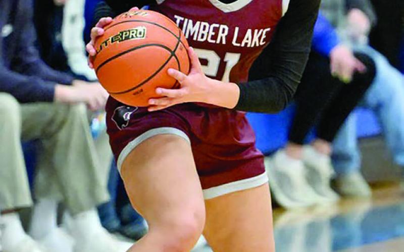 Timber Lake forward Jasmine Nash surveys the floor before running the Lady Panthers offense during recent girls basketball action. Nash, a senior, dropped a team-high 16 points to lift Timber Lake past Herreid– Selby before the holiday break and improve to 2-2 overall. Topic photo by Marie Du Preez