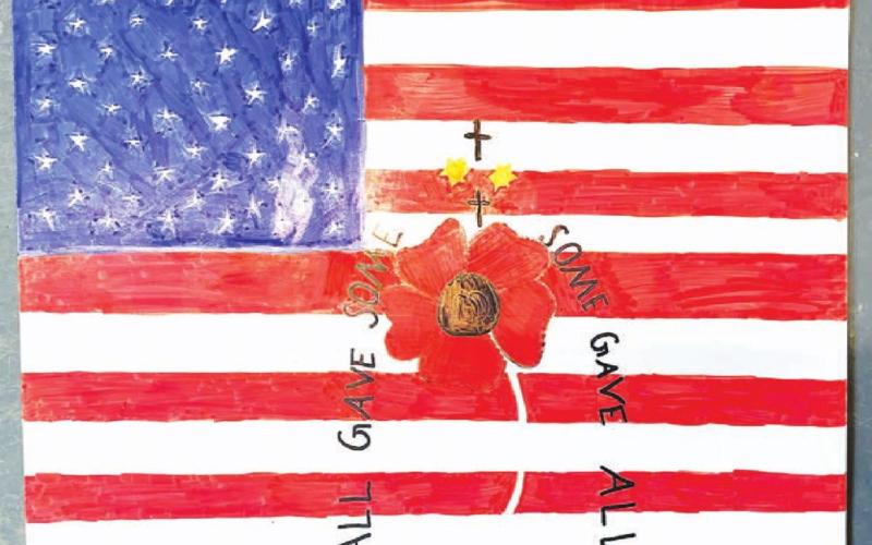 Poppy posters created by students at Timber Lake School encourage the public to support military veterans by buying poppies for Memorial Day. Poppies and donation cans are located in many businesses in Timber Lake and Isabel.