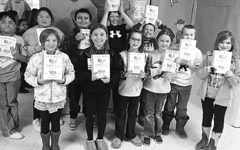 Third graders across the state, including these from Timber Lake Elementary School, received a free book from the S.D. Humanities Council and a group of sponsors. Photo courtesy of Carrie Beer