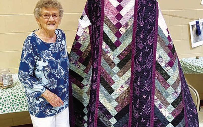 Joyce Kraft shows the quilt made by her granddaughter, Kylee Ayers, daughter of Richard and Caryn Kraft. Kylee’s mom is an expert quilter.