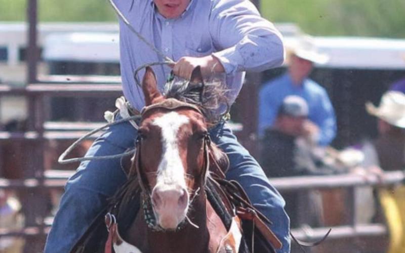 Brady Maher chases down a calf while roping in the Dewey County 4-H rodeo Sunday. Photo by Jon Flatland