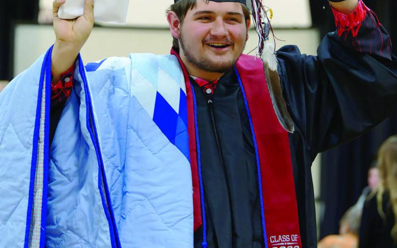 Timber Lake High School graduate Jesse Ridl celebrates after receiving his diploma at commencement exercises held Saturday, May 9. He is the son of Jackie Ridl and Ted Smolik. Photo by Marie DuPreez