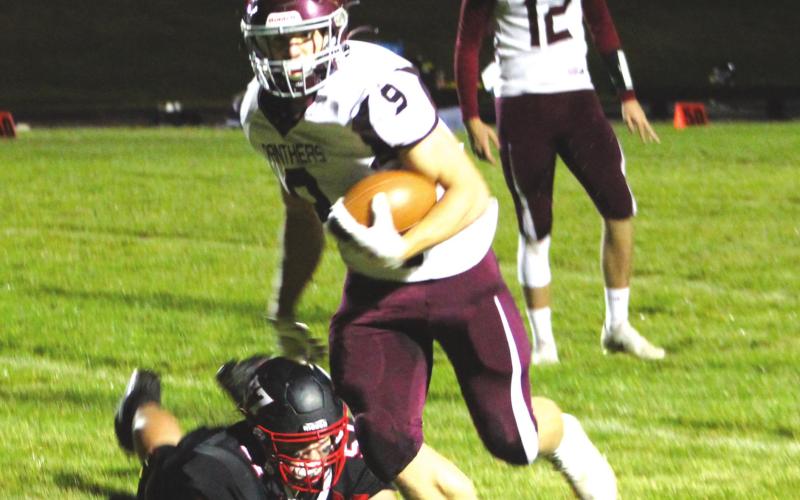 Senior running back Hank Kraft (9) made the game-winning catch on a pass from senior QB Kedrick Martin (12) to lift the Panthers over Lyman in the 9-man football playoffs. Photo by Ryan Deal