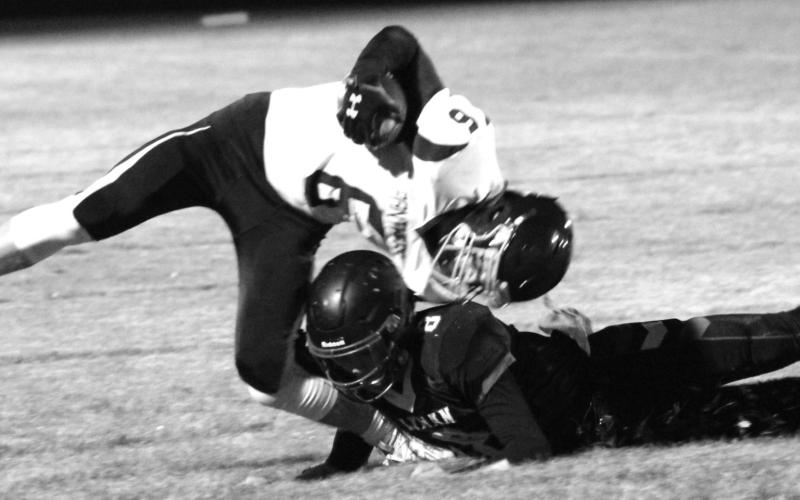 Timber Lake junior kick returner Brady Sandquist is tackled by a Lyman defender during their 9-man playoff football game. Sandquist was injured on the play and is doubtful for Friday’s game versus Platte-Geddes. Photos by Ryan Deal