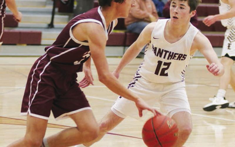 Panther sophomore Cole Ducheneaux (12) plays defense against McIntosh earlier this season. Photo by Jon Flatland