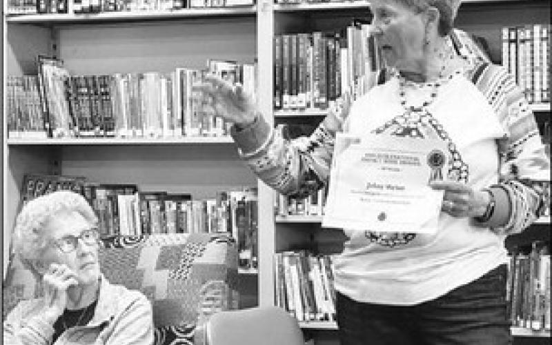 Local author receives another book award