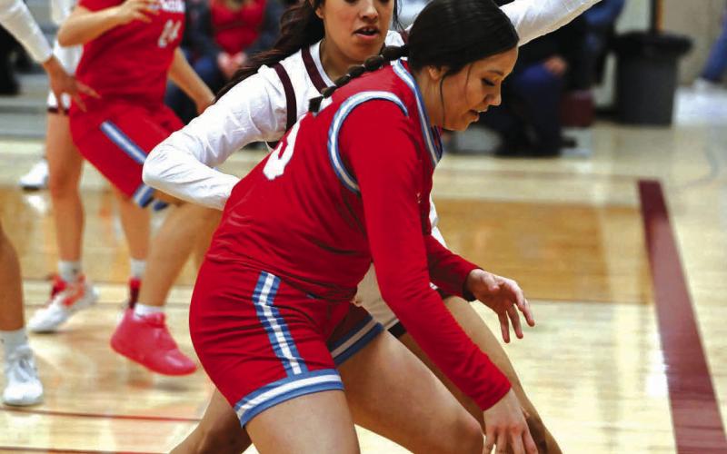 Timber Lake junior Kessa Bigger plays defense against Cheyenne-Eagle Butte junior KaiLoni Johnson during a non-conference inter-county matchup between the two teams last Friday. The Region 8B Girls Basketball Tournament tipped off play-in games on Monday. Timber Lake was facing Wakpala in first round action at Harding County on Tuesday, Feb. 20, as this issue of the Topic went to press. More sports on Pages 8-10. Photo by Marie Du Preez