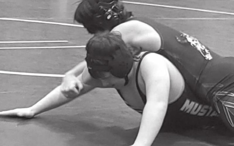 Brady Maher (bottom) wrestles for the Mclaughlin/Timber Lake Mustangs.