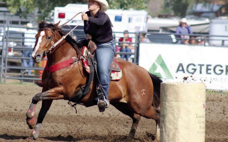 Photo by Jon Flatland Hope Kiel of Glenham, shown here competing in barrel racing, set a new arena record in the ladies breakaway roping event at the South Dakota 4-H State Finals Rodeo last weekend in Aberdeen, posting a blazing 1.5 second run.