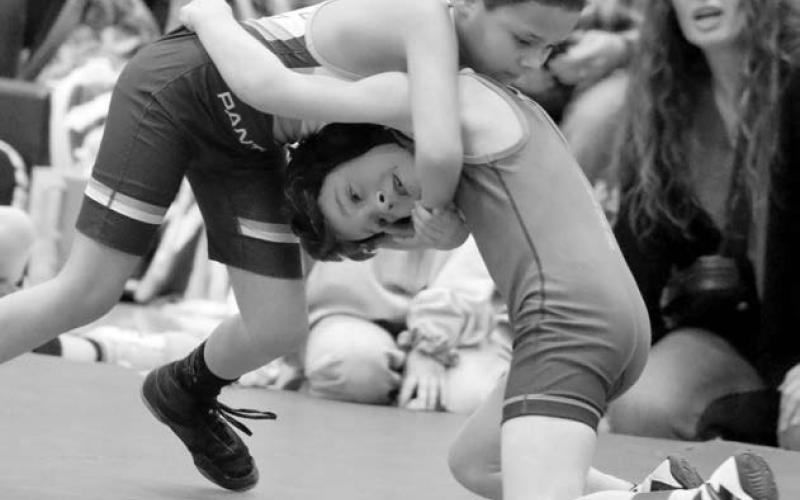 Timber Lake’s Wilson Wiedmer (left) locks up with Pate Chanley of Jones Co. in the boys 8U 57 pound bracket at the SDWCA Distrit 3 Wrestling Tournament held in Timber Lake on Saturday, March 8. Chanley went on to win an 18-7 Major Decision.