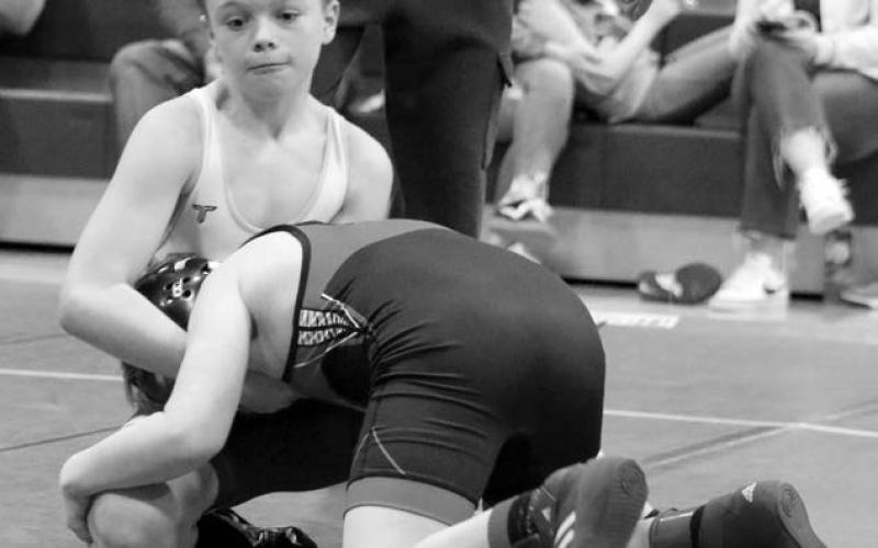 Panther wrestler Keaton Jones (left) keeps a hold on Beckett Carlisle of Pierre in the boys 12U 108 pound division. Jones pinned Carlisle and went on to earn second place overall. Photos by Jon Flatland