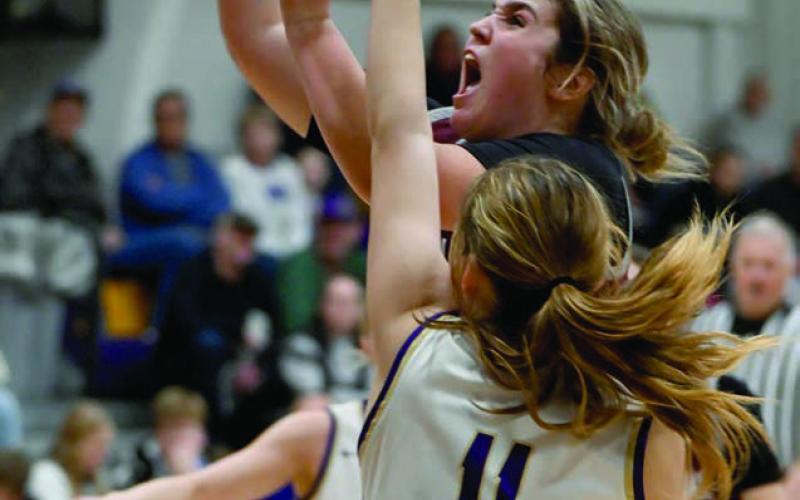 A determined Kate Biegler of Timber Lake takes the ball to the hoop while being defended by Sully Buttes guard Annaliese Van Zee during recent Lady Panthers girls basketball action. Photo by Marie DuPreez