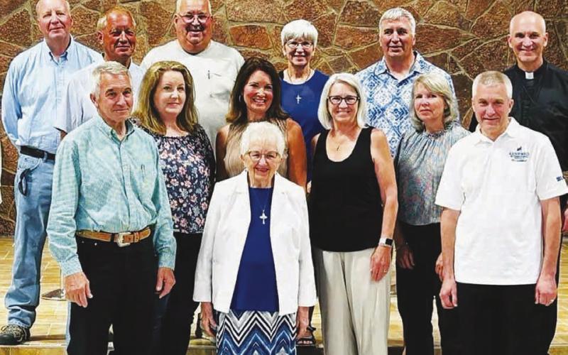 Mary Biegler with her children at her 90th birthday party last summer. Back: Bernard, David, Marty, Jane, Royce, Bishop Steve; front: Jerome, Mayme, Becky, Julie, Louise, Bart. A daughter, Rhonda, passed away in 2010.
