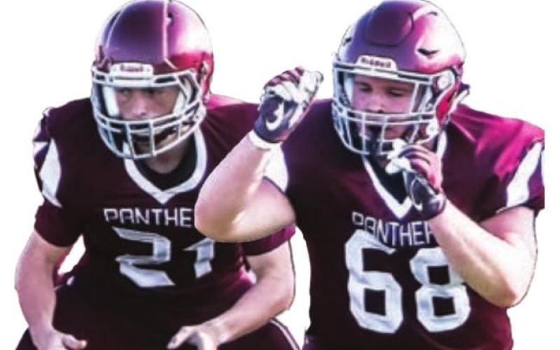 Juniors Caleb Quinn (21) and Sawyer Holzer (68)