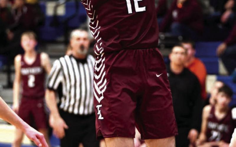 Junior Cole Ducheneaux puts up a running jumper against Lemmon in the Region 8B Tournament. Photo by Marie Du Preez