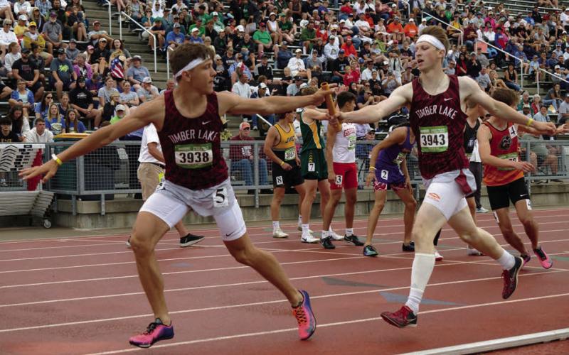 Holden Gill(right) passes the baton to Broc Bauer during the boys 1600 meter relay at the South Dakota State Track &amp;amp; Field Meet last weekend. Gill and Bauer along with Landen Bieber and Jackson Bigger finished third overall. Check out the Topic Facebook page for more photos from the state finals. Photo by Marie DuPreez