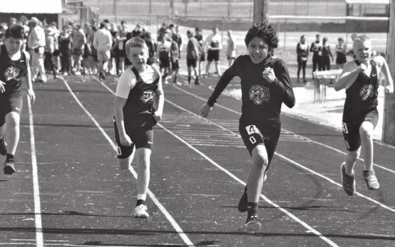 Dupree runners (L-R) Max Dupris, Hudson Terveen, Marty Marshall and Garrick Dekle sprint down the track in the 100 meter dash event of the Bowman junior high track meet held April 11.