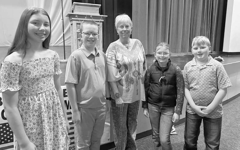 Johny Weber (middle) was the guest speaker at Timber Lake’s Memorial Day program on May 26. Students who read their Americanism essays and poems were (l-r): Brinley Mowrer, Garrett Nilson, Stella Nilson, and Isaac Schweitzer.