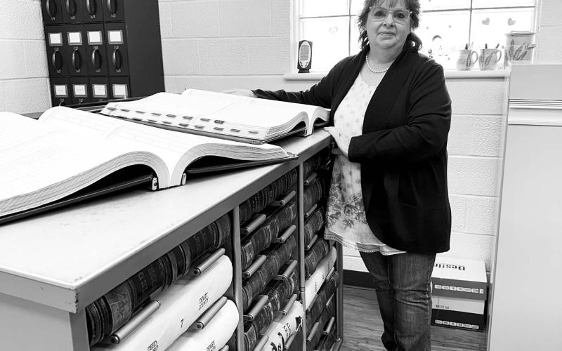 The Dewey County Commission is considering a new space for safekeeping of property records and files in the Register of Deeds office. Cost estimates from HKG Architects range from $109,000 to $265,000 plus architectural fees. Register of Deeds Deborah Goldade (ABOVE) has accumulated about $42,000 for the project from fees paid by users. Photo by Kathy Nelson