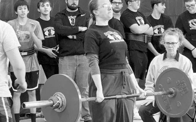 Maria Scherer completes one of her lifts at a powerlifting meet in Box Elder last week. Scherer took first place in her division.