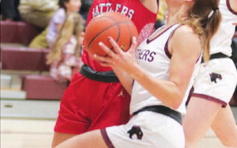Timber Lake’s Shay Kraft drives for a lay-up against a Potter County defender during action earlier this month. Kraft leads an undefeated Lady Panther squad into the conference tournament beginning Thursday, Jan. 19. Photo by Jon Flatland