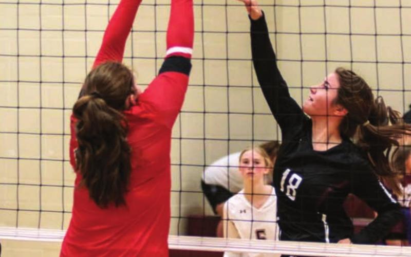 Timber Lake’s Natalie Gross (18), Sara Holzer (24) and Averie Marshall (5) in action versus the Bison Cardinals last week. Photo by Jon Flatland