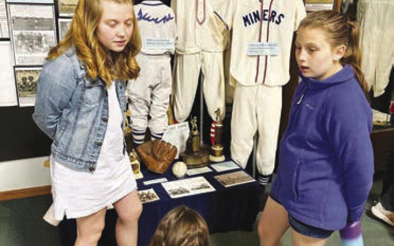 LEFT: Elyse Parker, Ada O’Leary and Tegan Baker learn why a baseball team from Firesteel was called the Miners.