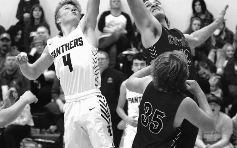 Timber Lake’s Gracen Hansen and Lemmon’s Jacob Sonsalla battle for a rebound during the Panther boys season home opener last Friday, Dec. 9. Hansen finished with six points and three rebounds in a 63-46 victory. Photo by Jon Flatland