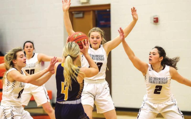 Panther players (L-R) Shay Kraft, Maci Maher, Stormi Hulm and Tia LeBeau play defense.