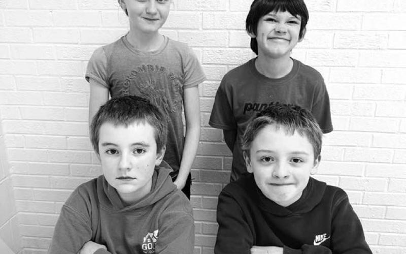 Grade 5 FRONT: Camden Goldade and Ben Mareska (top spellers); BACK: Kendyl Gill and Colton Ridl (alternates).