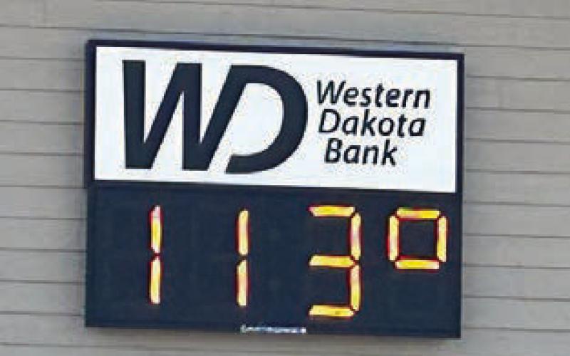 When Timber Lake’s Days of 1910 parade came down Main Street on Saturday afternoon, the 113 on the sign at Western Dakota Bank (at right) was not the time. It was the temperature. Everyone made the most of it with umbrellas, sprays of water, and popsicles.