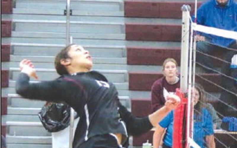 Timber Lake junior middle hitter Jasmine Nash goes up for one of the powerful kill spikes she is known for around the Little Moreau Conference during action at the LMC Volleyball Tournament held Saturday, Sept. 23, in Timber Lake. Photo by Jon Flatland