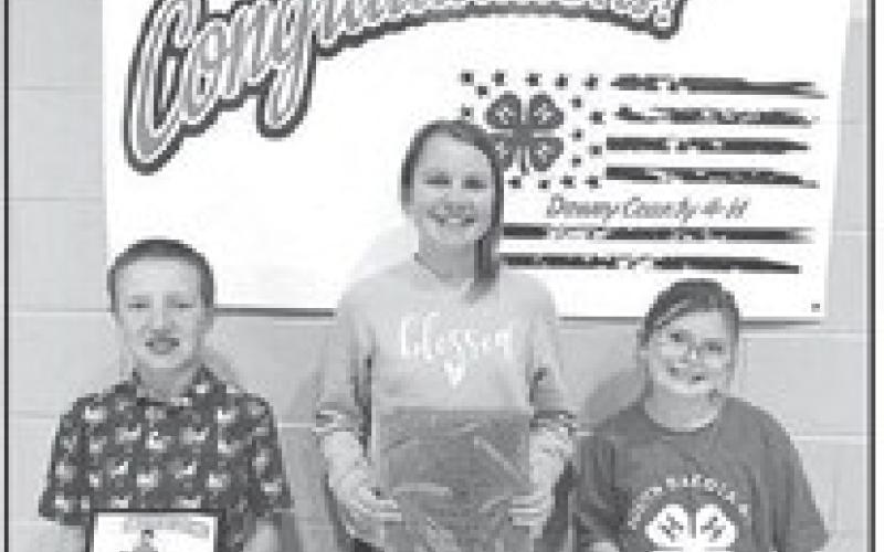 Greyson Goldade (left) received the Family and Consumer Science Award; Maya Biegler (middle) received the Club Secretary Award; and Stella Nilson (right) received the Club Reporter Award.