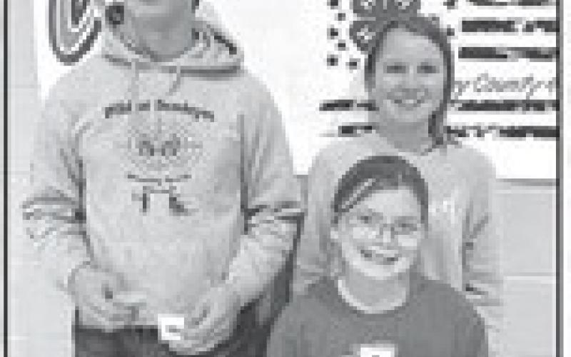 Project Award winners (given to members who are enrolled in a specific project area for three years and complete a talk or demonstration in that area). Front: Stella Nilson; back: Levi Berndt, Maya Biegler. Photos by Kathy Nelson