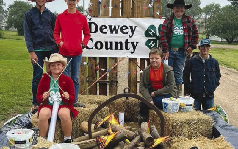 Top, the Western State Bank float in the Isabel Parade received the “Best of Show” award. Middle, members of American Legion Post 120 of Isabel destroyed damaged American flags in what became a very patriotic and emotional ceremony during the rodeo. Below, The Cordewzy 4-H Club won the award for “Best Youth Entry” in the Isabel Parade. Look for A LOT more photos on the Topic Facebook page! Photos by Jon Flatland and Denise Perryman