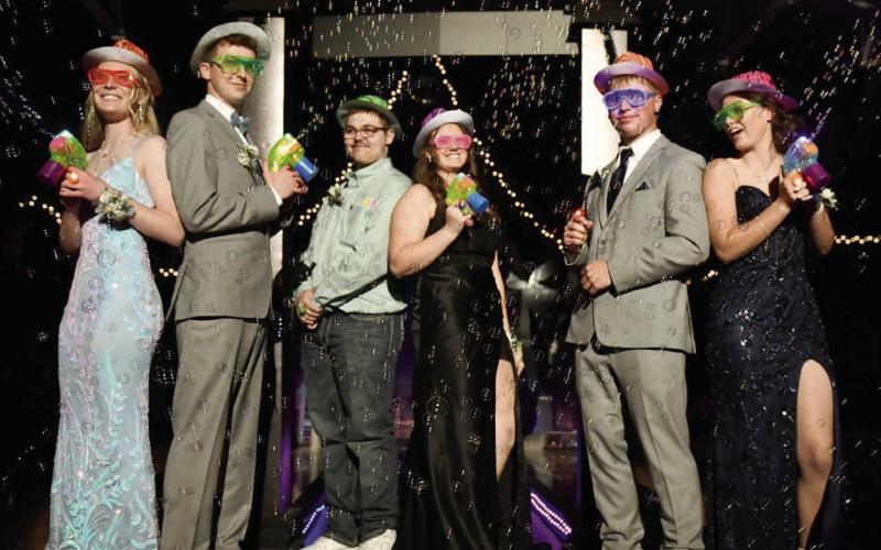 Having some “Miami Nights” fun with bubble guns at the Timber Lake High School Prom on April 25 are (l-r) Brynn Odenbach, Hudson Gill, Cooper Goldade, Mya Bauer, Devon Keller, and Ayla Bauer. Photo by Charles Miner