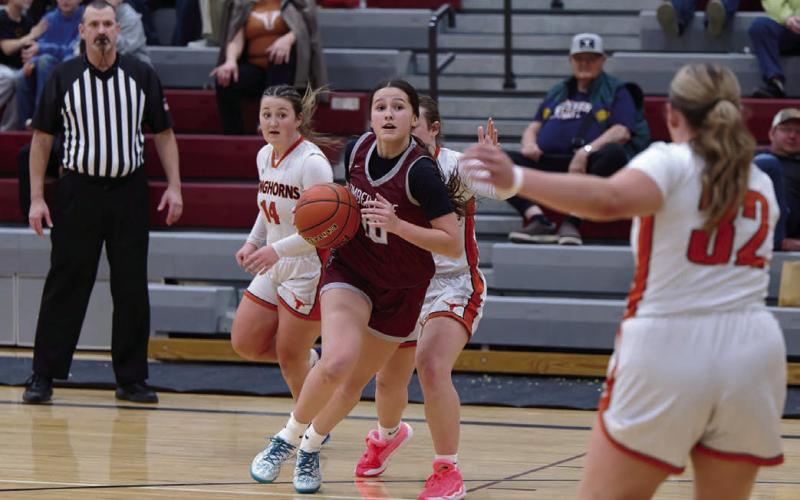 Timber Lake forward Jaylee Schoelerman dribbles past a pair of Faith defenders and looks for a lane to the basket or a teammate she can dish to during the Panthers’ overtime victory over the Longhorns last Tuesday, Jan. 6. Schoelerman played a key role in the win, finishing the game with a team-high 16 points. Timber Lake will host Sully Buttes on Tuesday, Jan. 20 before the LMC Tournament in Lemmon Jan. 23-24. Find more sports on Pages 8-10. Topic photo by Marie DuPreez
