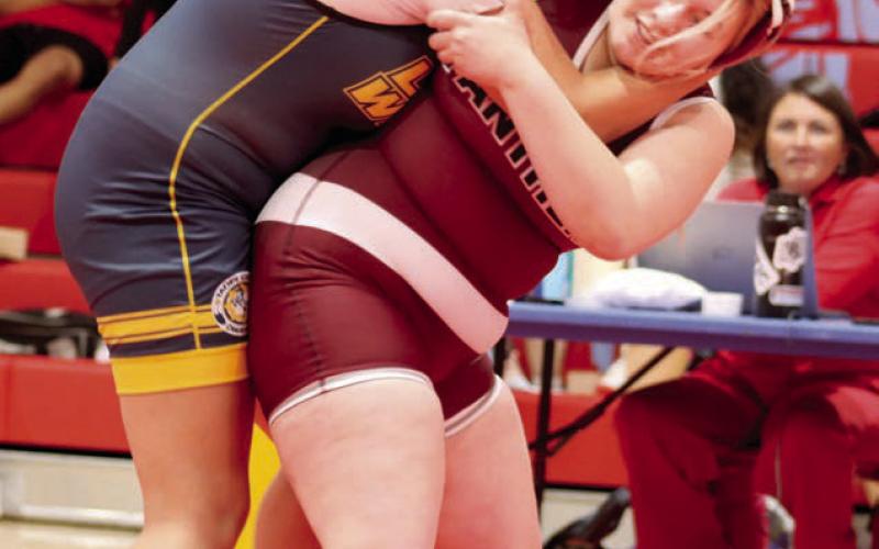 Timber Lake’s Lilly Veit begins a hip toss of her opponent Brealle Belt of Little Wound at the C-EB-Dupree Round Robin Tournament held Monday, Feb. 3, in Eagle Butte. Veit went on to pin Belt for the win. Photo by Jon Flatland