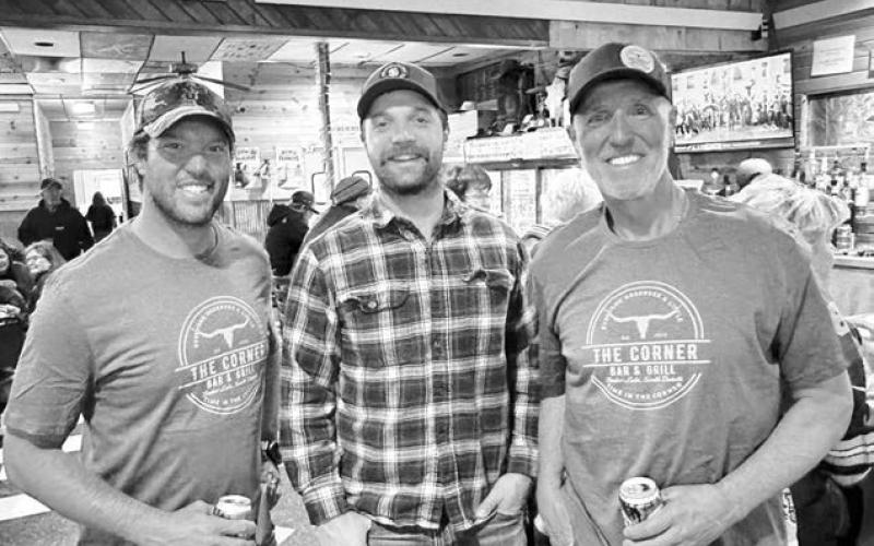 Wearing their new Corner Bar &amp;amp; Grill t-shirts are Steve Schmelter (right) of Bluffton, SC and his son R.J. of St.Thomas, Virgin Islands (left). They learned a lot about Tucker Kraft from his brother, Tanner (middle).