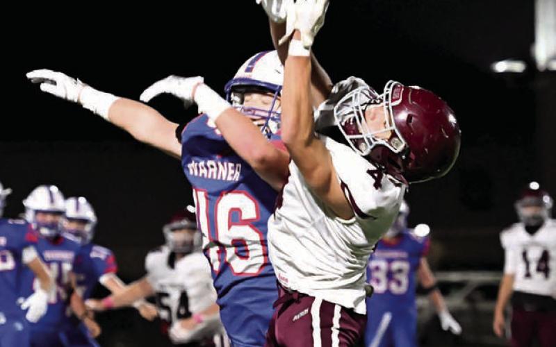 A Warner defender knocks a pass away from Timber Lake receiver Broc Bauer during the first-round of the Class A football playoffs last Thursday in Warner. Photo courtesy of Robb Garofalo/The Aberdeen Outsider
