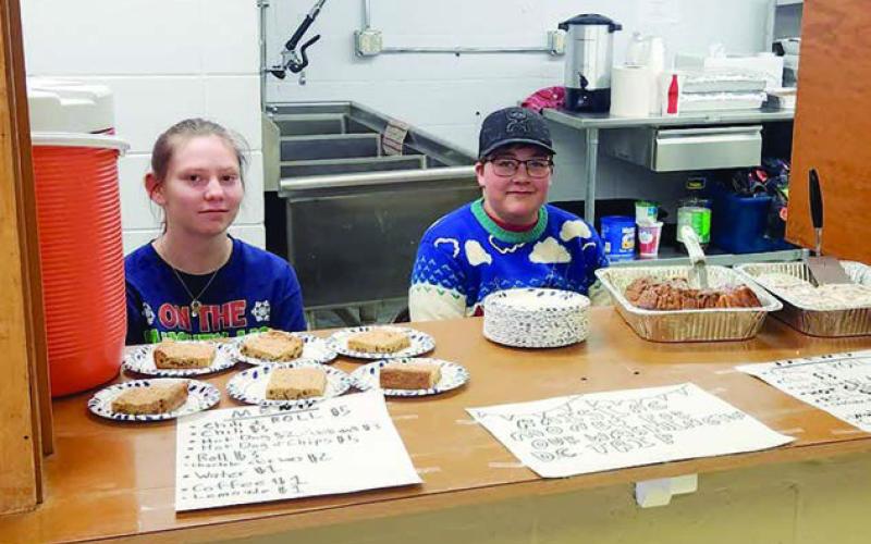 Tristan Swift and Gabe Bridges were selling concessions at the craft fair to raise funds for a Washington, DC trip being organized through the Timber Lake School.
