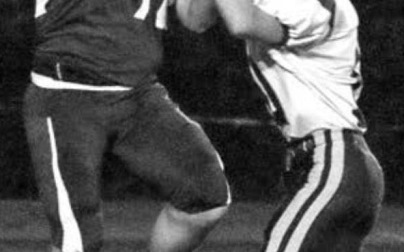Junior Jaiden Ducheneaux tries to pull in a pass over the head of a Newell defender.