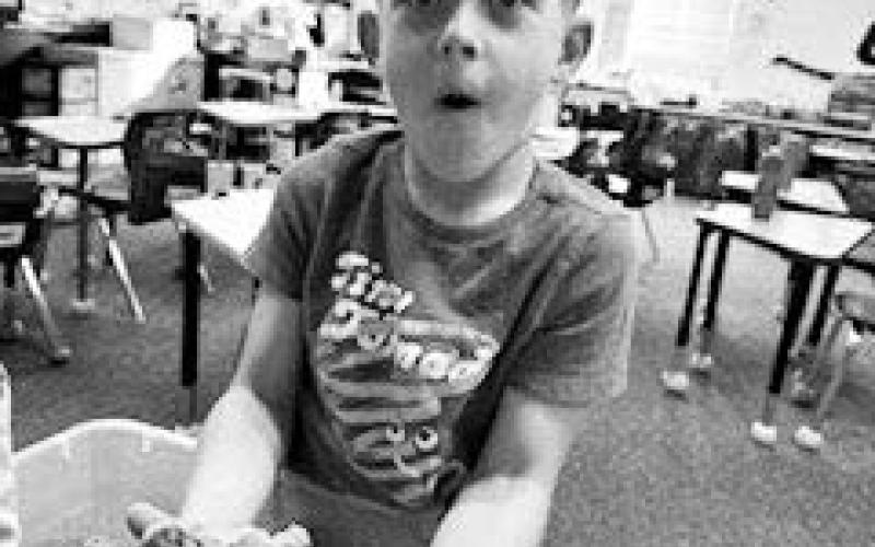 Canyon Quaschnick is interacting with Kinetic sand.