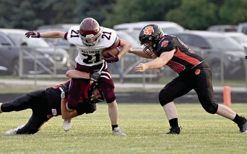 Panther wide receciver Eddie Keller (21) battles for yardage on a pitch-out during first half action of Timber Lake’s football season opener at Ipswich last Friday, Aug. 23. Timber Lake hosts Philip at Doug Kraft Field on Friday, Aug. 30, with kickoff set for 6 p.m. Photo by Jon Flatland