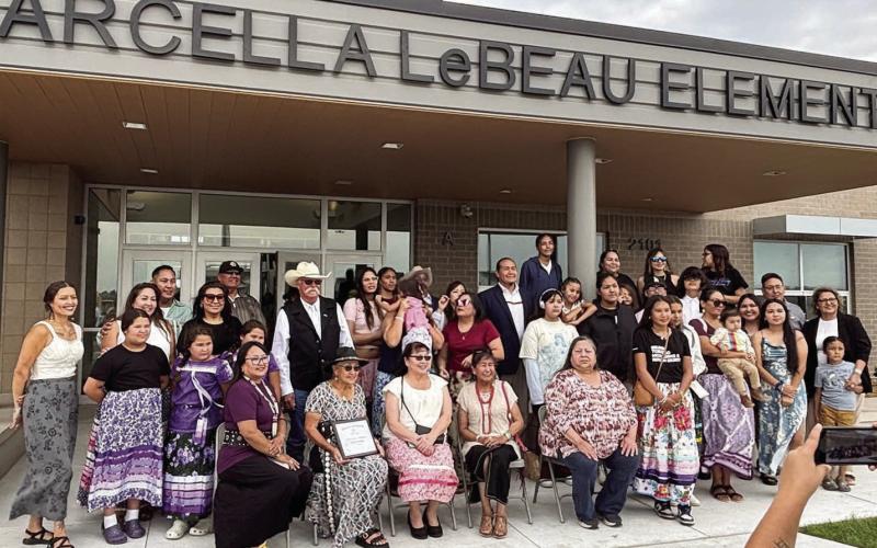 Members of Marcella LeBeau’s family gather for a photo under the front entrance to Marcellaa LeBeau Elementary School in Sioux Falls after a dedication and naming ceremony for the new school last week. LeBeau wss a respected elder and matriarch of the Cheyenne River Sioux Tribe. Submitted photo