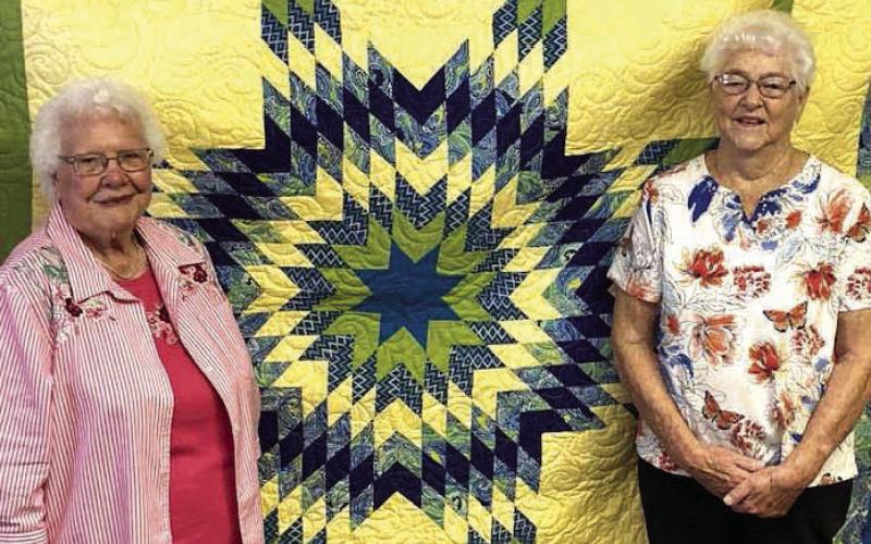 Twila Schuler, left, was the lucky winner of this year’s beautiful Dupree Volunteer Fire Dept. Auxiliary quilt. Each year, for the past 33 years, Virginia Till (right) has made and then generously donated a lovely quilt for the Dupree Volunteer Fire Department Auxiliary to raise funds with by doing a raffle during the Dupree Pioneer Days Celebration. Photo by Patty Peacock