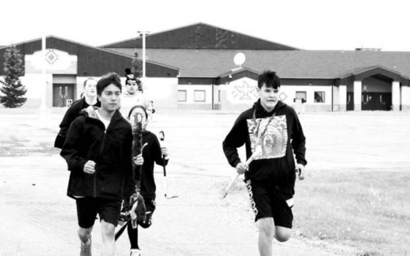 Oyate Isnala runners leave from Tiospaye Topa School at LaPlant